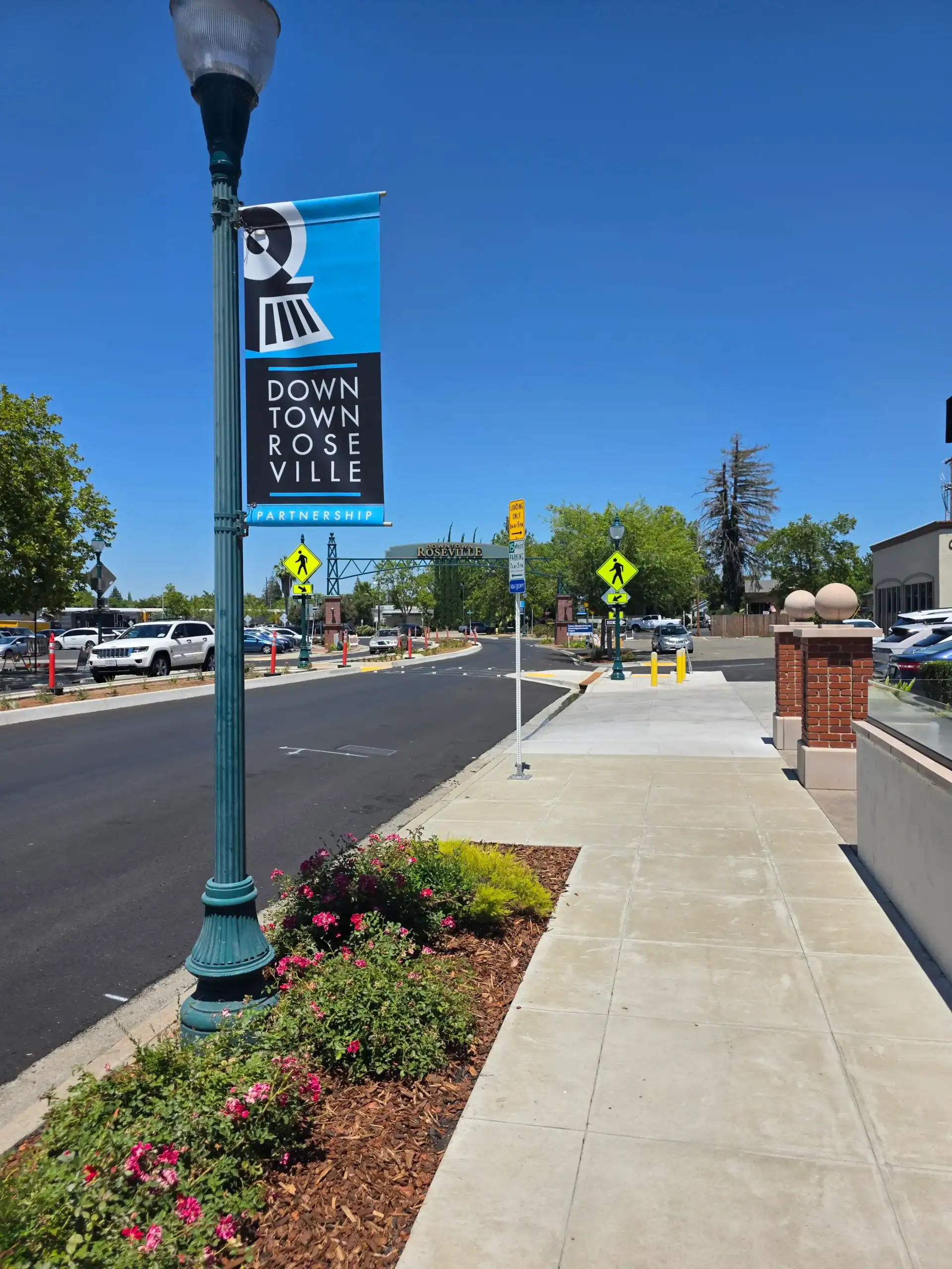Downtown Roseville with Entrance Sign in on Vernon St Background Downtown Roseville with Entrance Sign in on Vernon St